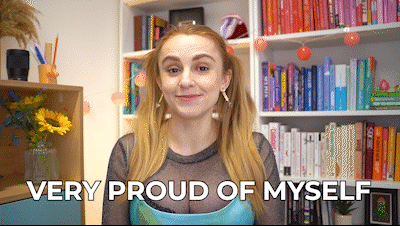 Hannah saying, "Very proud of myself!" while wearing the 13 Going on 30 dress