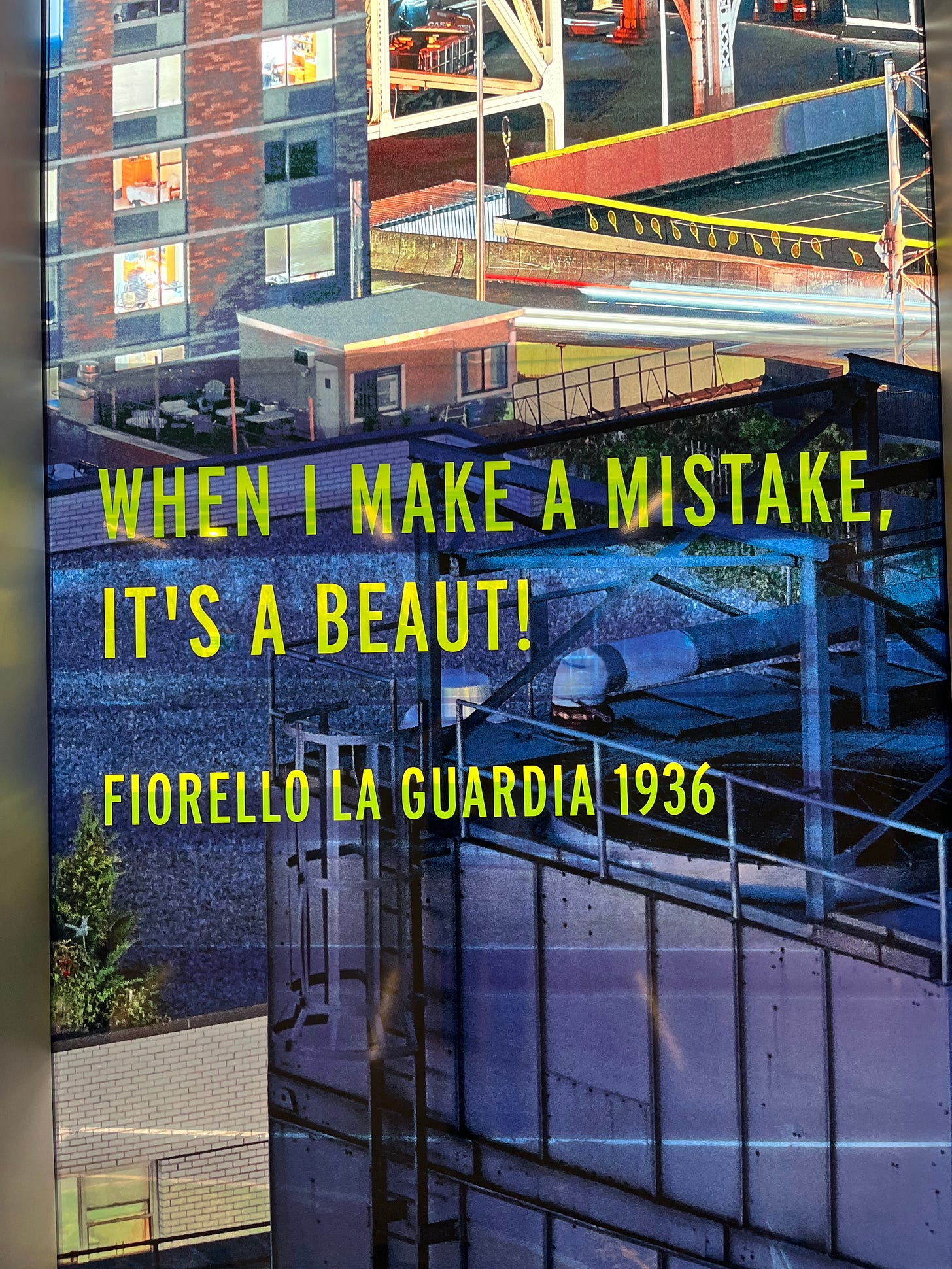 Window art at LaGuardia which features scenes from around the city with the quote "When I Make a Mistake, It's a Beaut!" from Fiorello LaGuardia 1936
