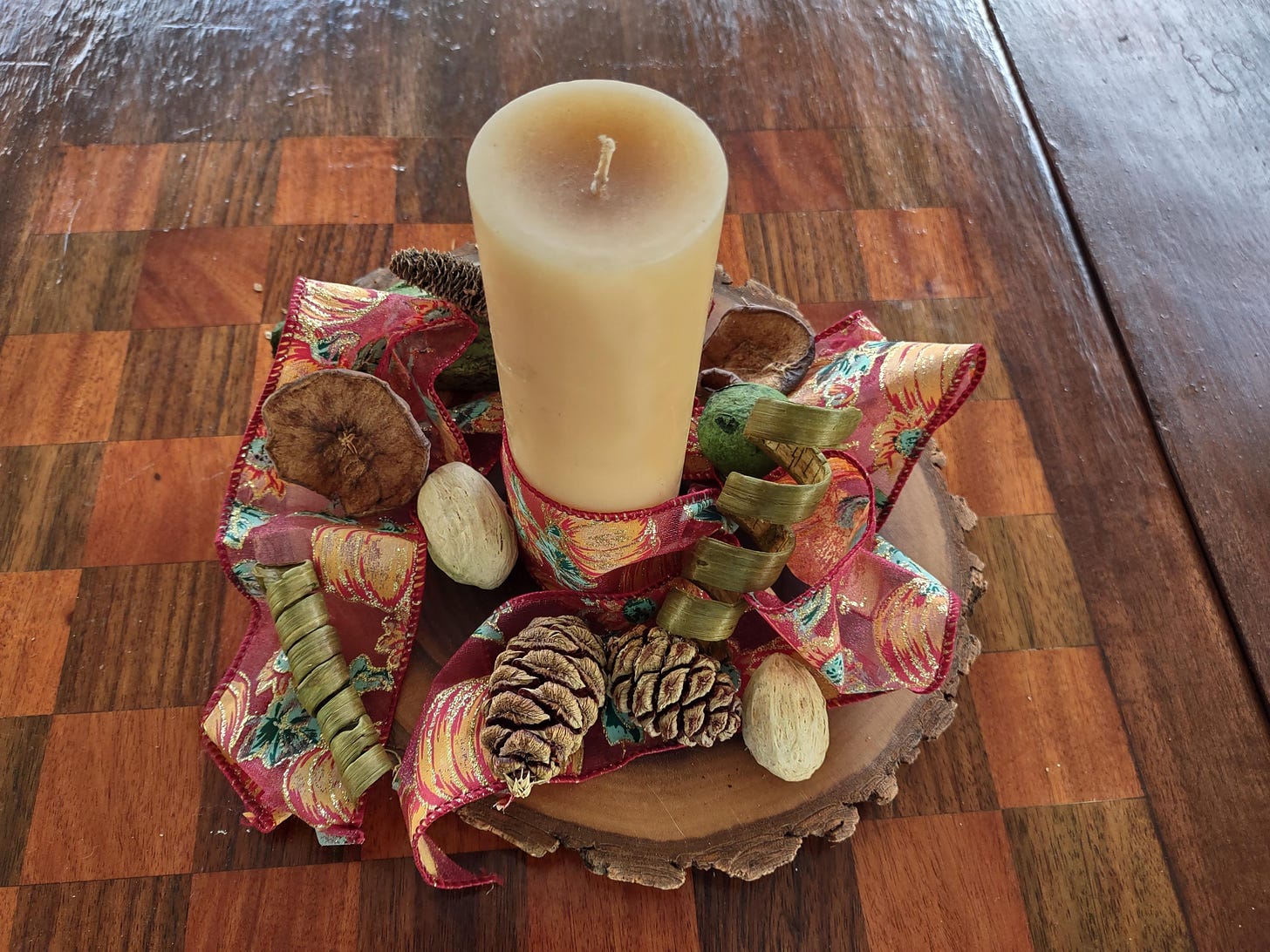 autumn decor piece with candle and pine cones