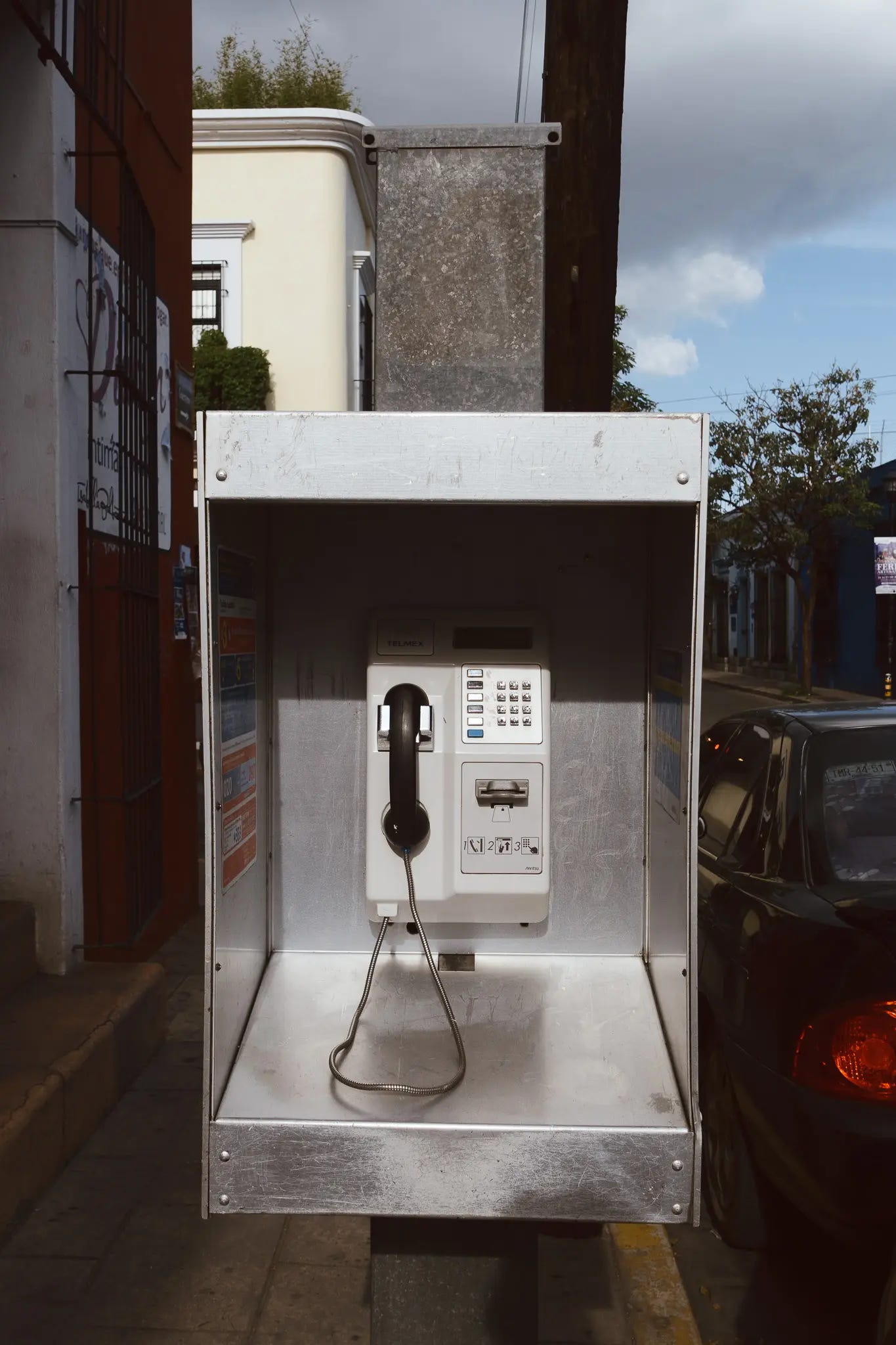 an old telephone booth in oaxaca