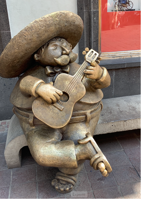 Sculpture of a man playing a guitar