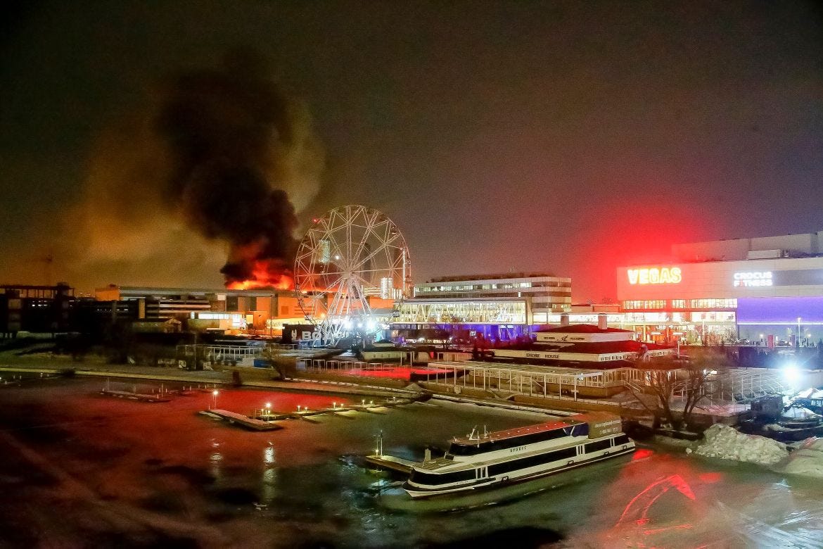 A massive blaze is seen over the Crocus City Hall on the western edge of Moscow, Russia, Friday, March 22