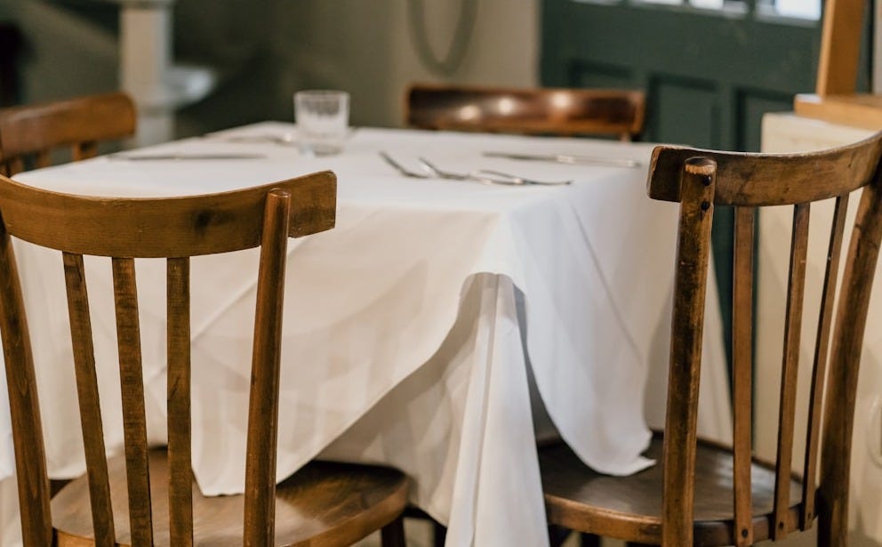 brown wooden chair beside table