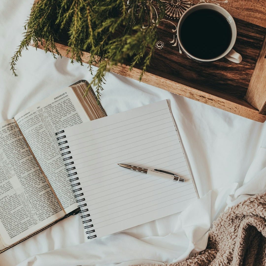 white notebook on white textile