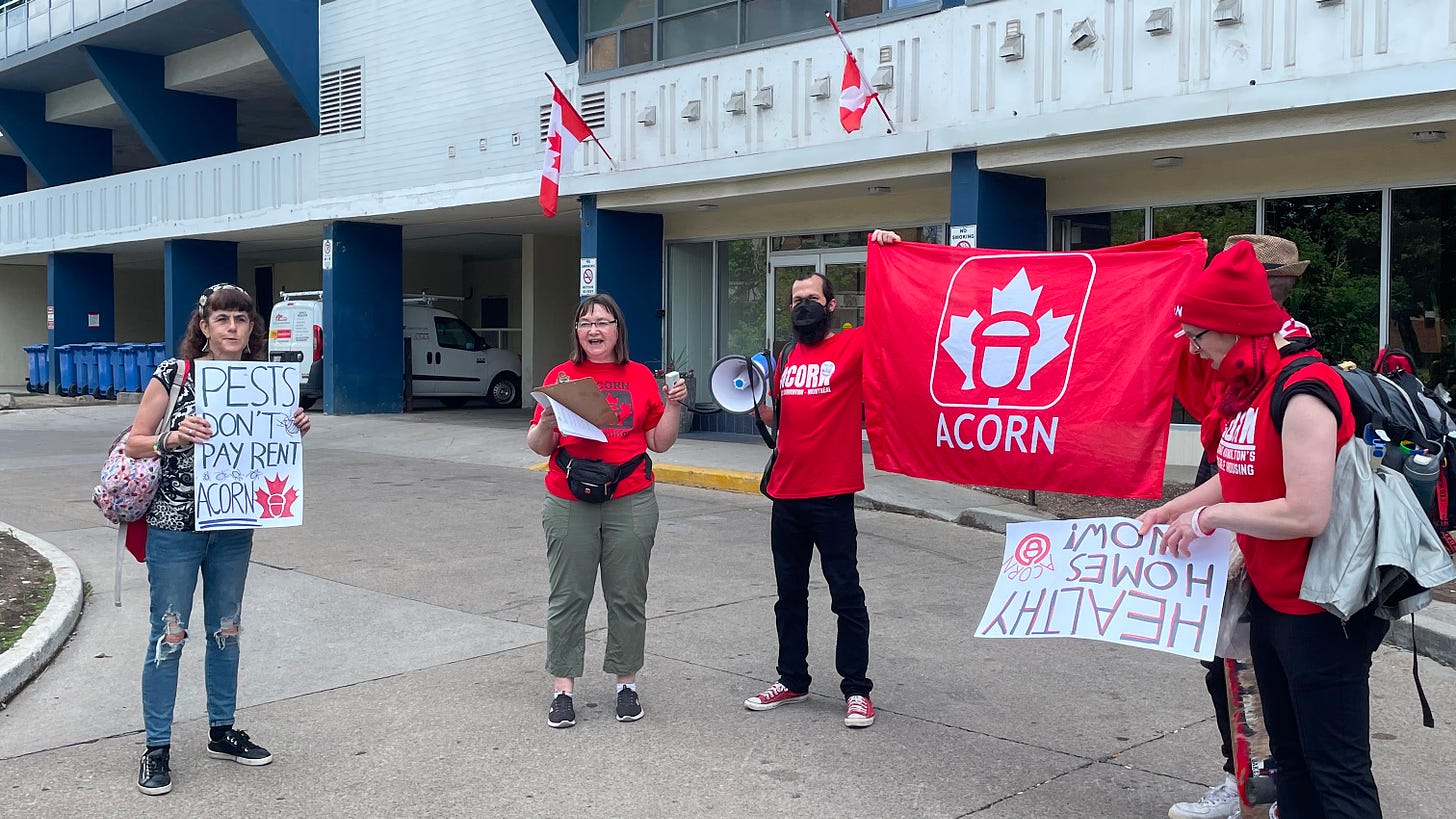 ACORN members leading a rally outside of a Hamilton apartment building in June 2022