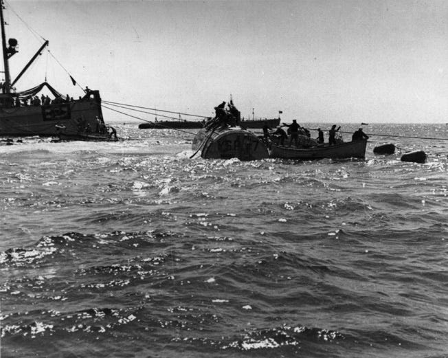 The USS Falcon and the submarine USS Sculpin take up position during the effort to raise the sunken Squalus from the ocean floor.