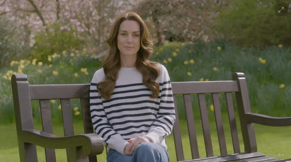 Princess Kate sitting on a bench in jeans and stripy jumper