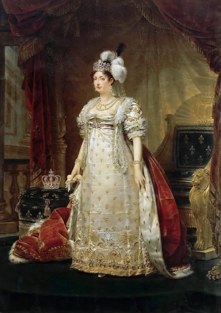 Portrait of Marie Thérèse Charlotte of France. She's dressed in an elegant white gown decorated with golden decorations including the royal French fleur de lys. Next to her is a crown, designating her status as a princess and member of the defeated monarchy. She wears a crown and a headdress decorated with feathers. She was a friend of Ernestine.