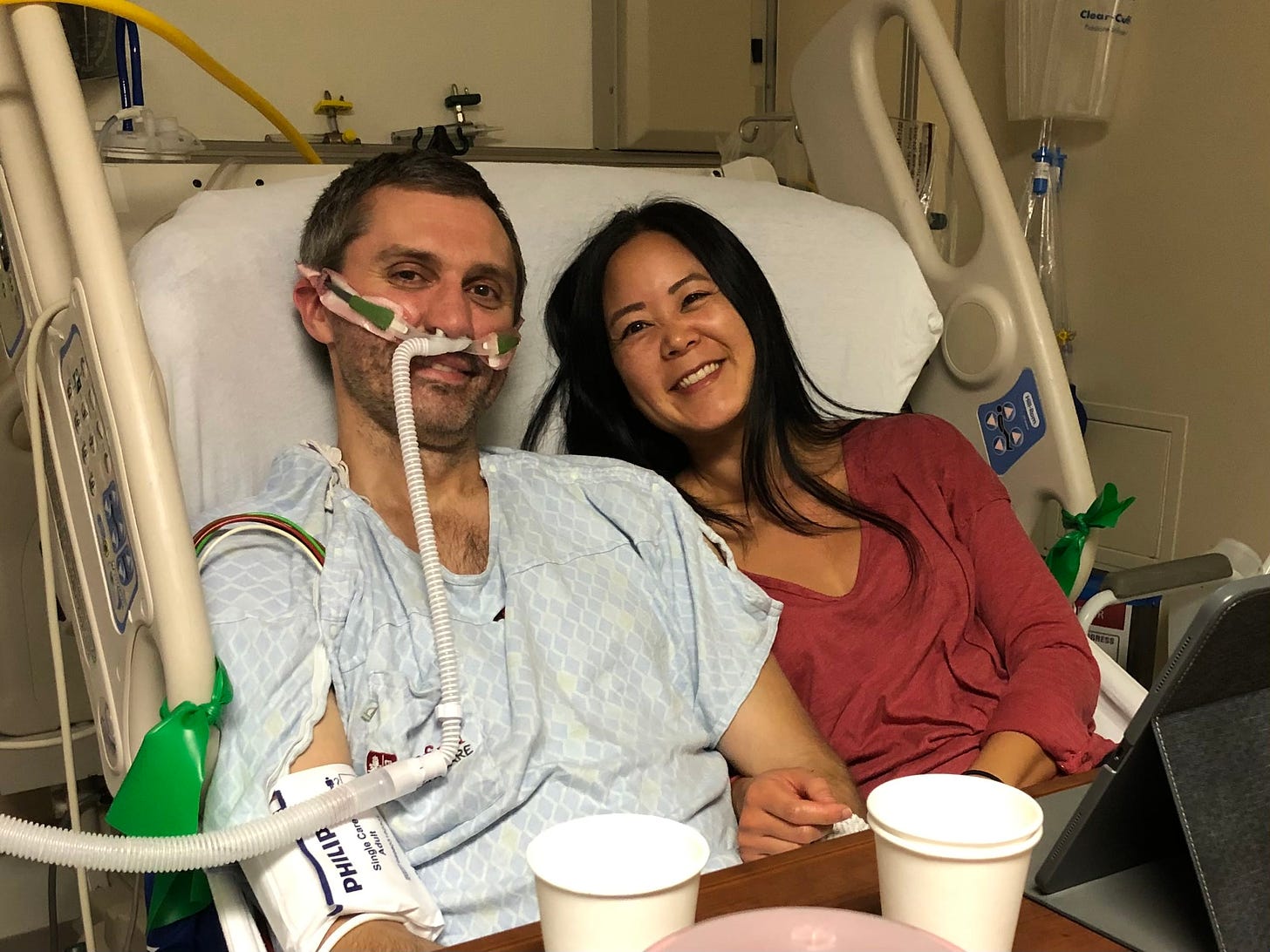 Author Evelyn Skye with her husband, Tom, in the hospital in 2019 before his lung transplant