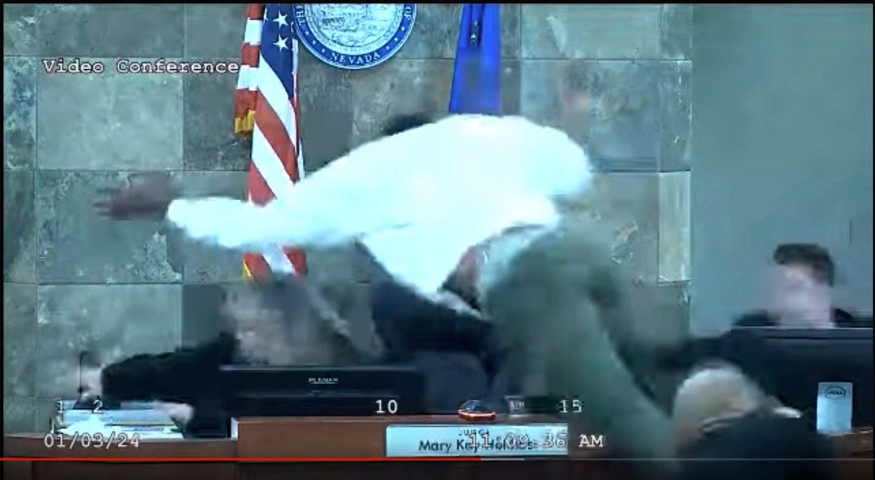 Screenshot of Deobra Redden jumping over Judge's bench to attack Judge Mary Kay Holthus via NBC News