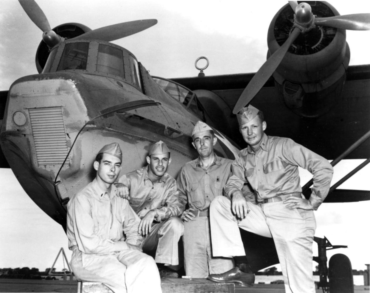 May be an image of 4 people and aircraft