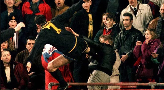 Eric Cantona of Manchester United kung-fu kicking a racist football supporter.