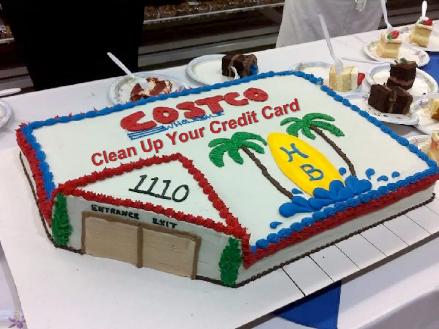 Picture of a large sheet cake shaped and decorated like a Costco credit card with the message: Costco Clean Up Your Credit Card.