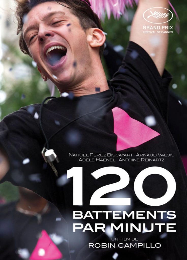 Movie poster for 120 BPM, featuring a young white man in a black t-shirt with a hot pink triangle on it. The man looks to be celebrating, cheering wildly as confetti falls around him. 