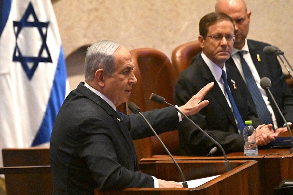 Israeli Prime Minister Benjamin Netanyahu speaks at the opening of the 25th Knesset session, in occupied al-Quds, occupied Palestine, Monday, October 28, 2024 (AP)