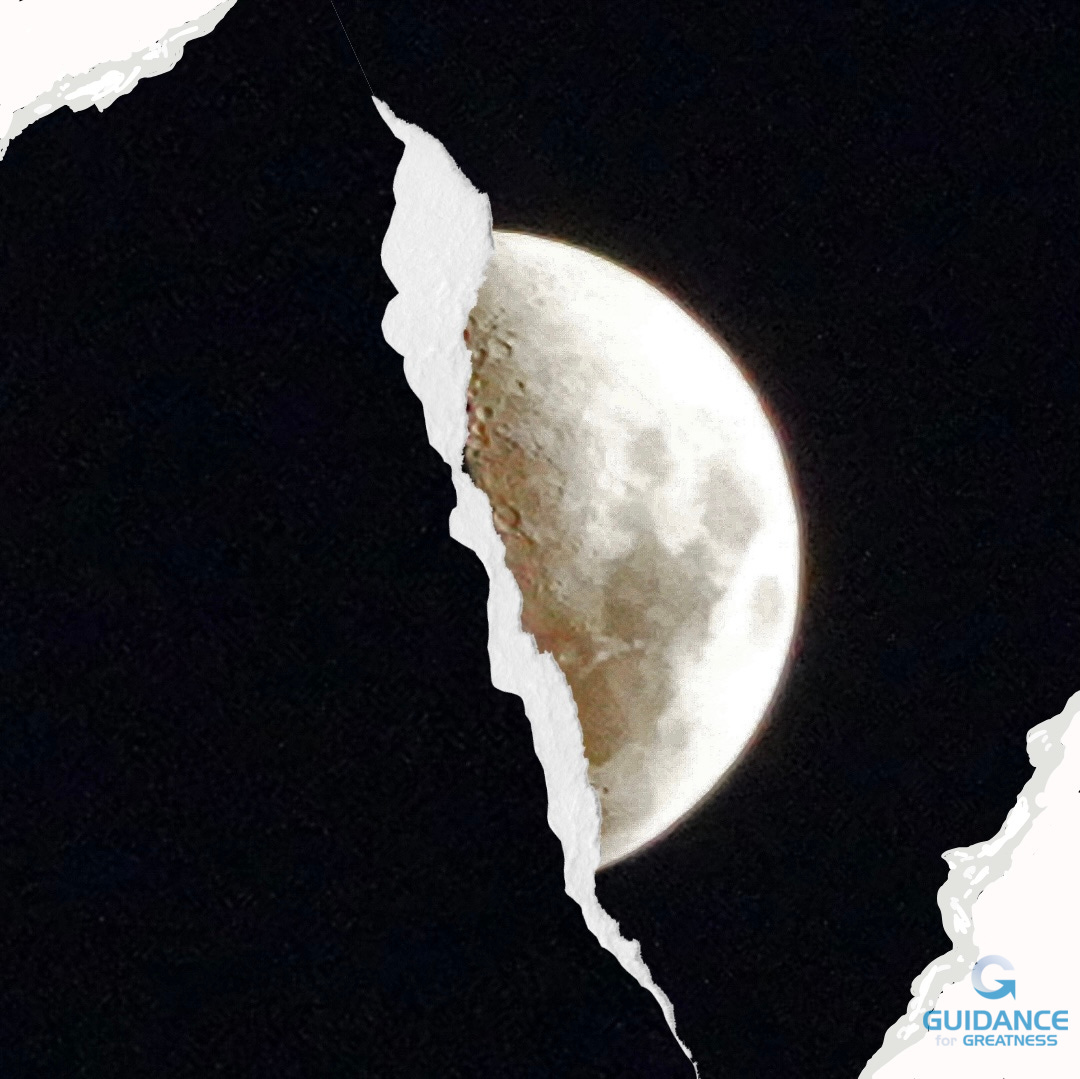 photo of half moon. There is a tear in the photo concealing the dark side of the moon. the corners of the photo are torn too.