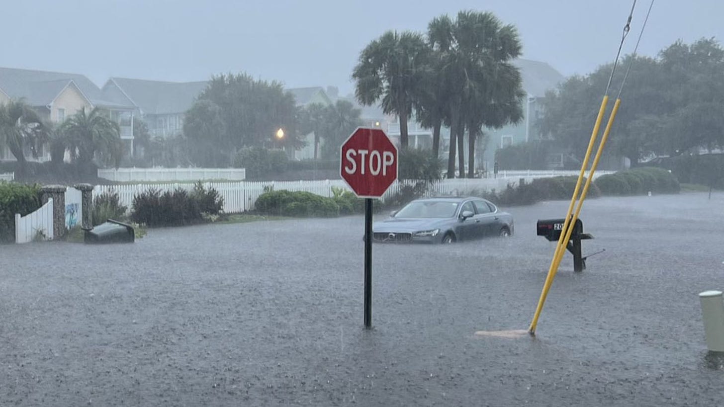 Flooding in North Carolina swamps cars and roads near the Waterfront Villas and Marina in Carolina Beach on Monday, September 16.