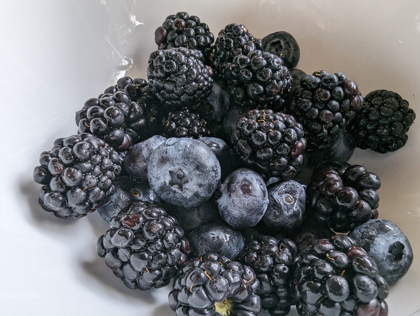 blackberries and blueberries in a bowl