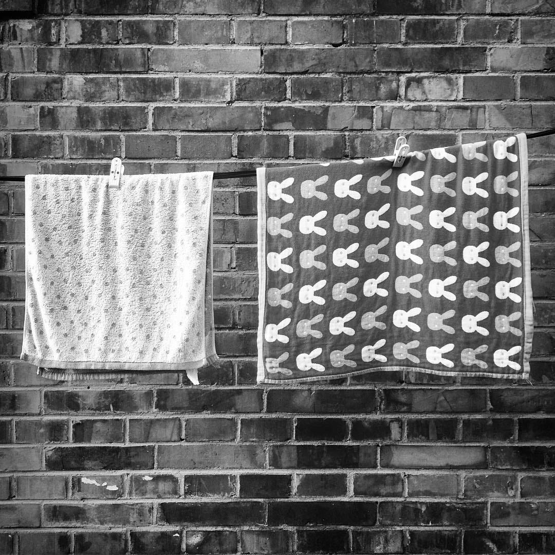 Towels hanging out to dry in a historic Beijing neighborhood.