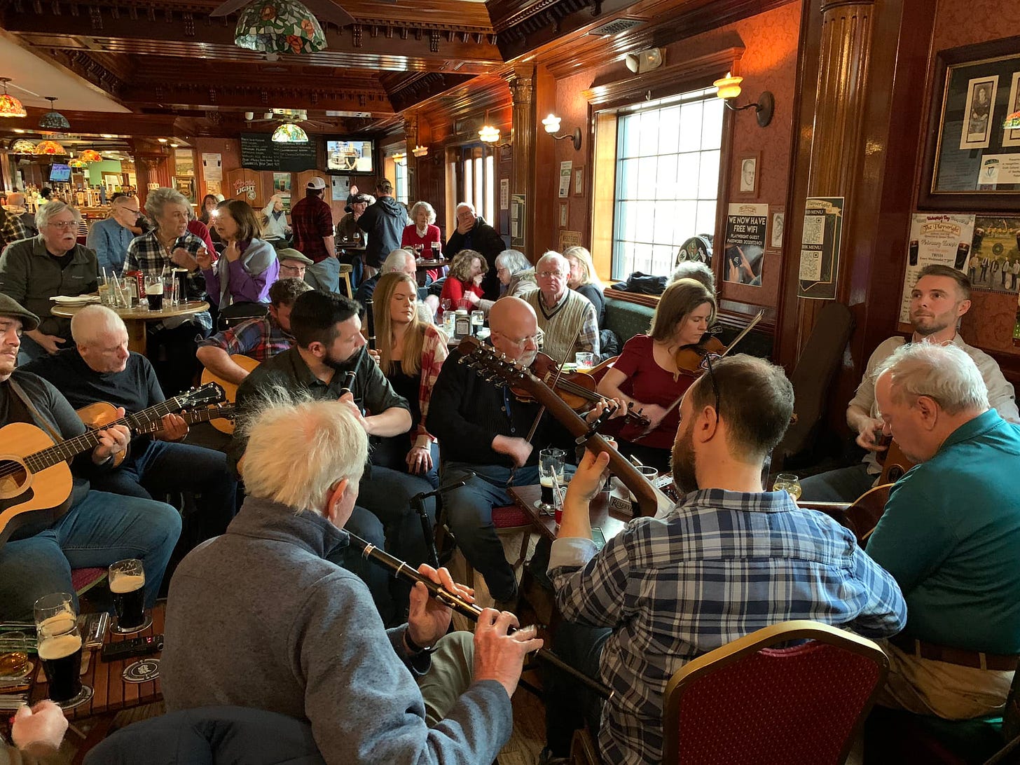 May be an image of 6 people, people playing musical instruments, people standing and indoor