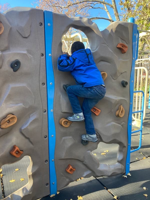 May be an image of 1 person, child and climbing