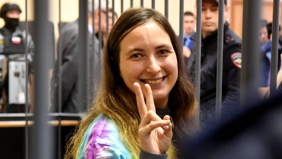 Russian artist Alexandra Skochilenko, 33, accused of spreading disinformation about the Russian army for changing supermarket price tags with messages criticising Russia's military offensive in Ukraine, gestures from inside a defendants' cage during her verdict hearing at a court in Saint Petersburg on November 16, 2023. (Photo by Olga MALTSEVA / AFP) (Photo by OLGA MALTSEVA/AFP via Getty Images)