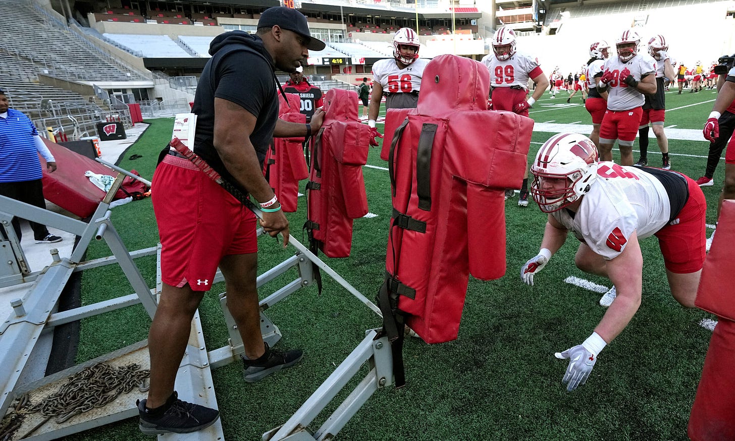 Wisconsin Badgers Football HC Luke Fickell hired Greg Scruggs to be the Badgers defensive line coach -- who is working with defensive lineman Ben Barten at practice.