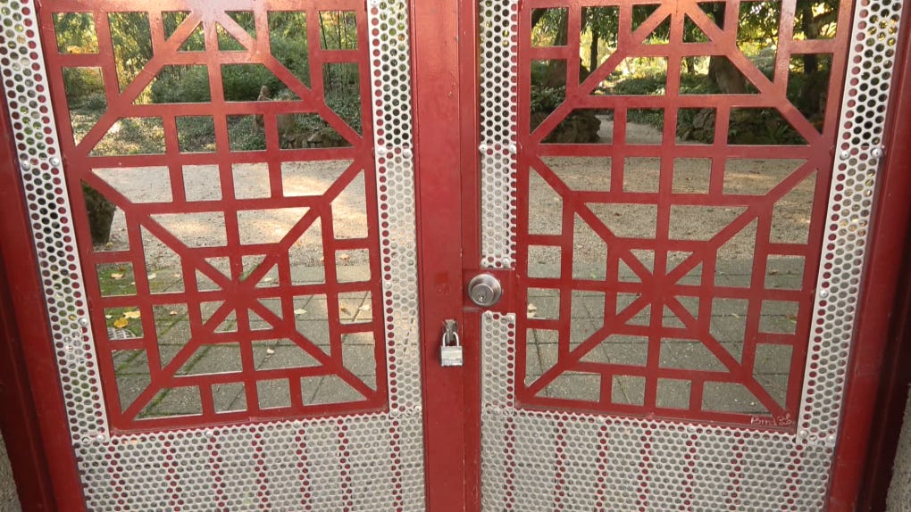 This photo shows the gates of Sun Yat-Sen Park which lock at 4 p.m. 