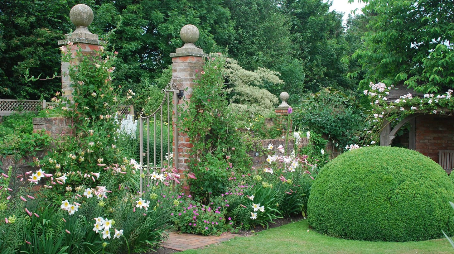 Semi-formal garden design in the Font Garden at Wollerton Old Hall, UK.