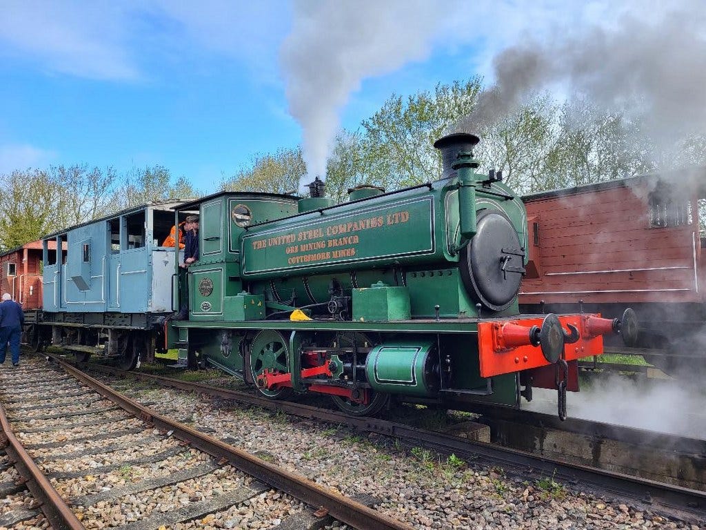 Andrew Barclay steam locomotive on brake van ride duties.