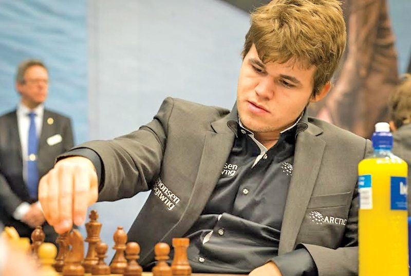 magnus carlsen defends his title in 2018