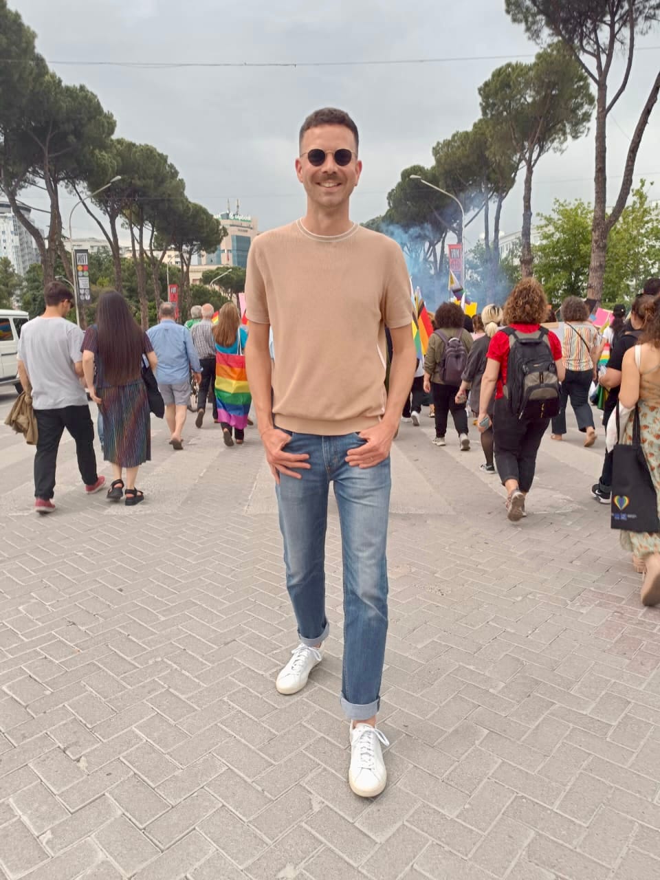 Luke standing in the march at Tirana Pride 2023.