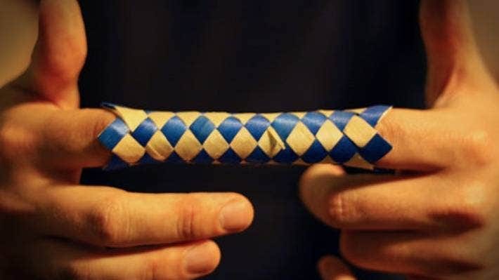 The finger trap solution is simple. Fixing our social problems may be simple too, if we tried pushing instead of pulling.