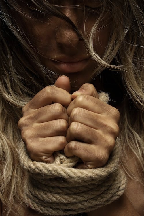 Free Close-Up Photo of Woman With Her Hands Tied With Rope Stock Photo