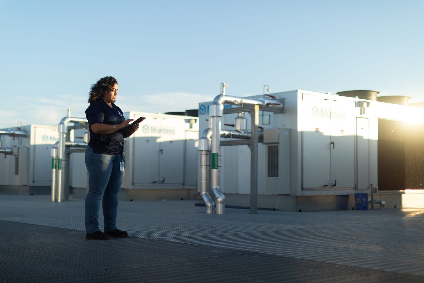 Deborah Martinez Castellanos checks out the rooftop chillers at the data center where she works to ensure they are functioning properly.