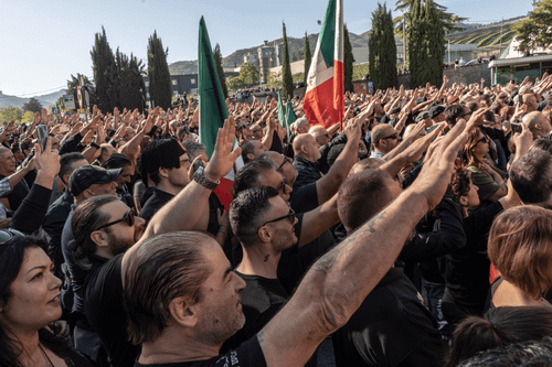 Fascist sympathizers give the Italian fascist salute in Predappio, Italy.