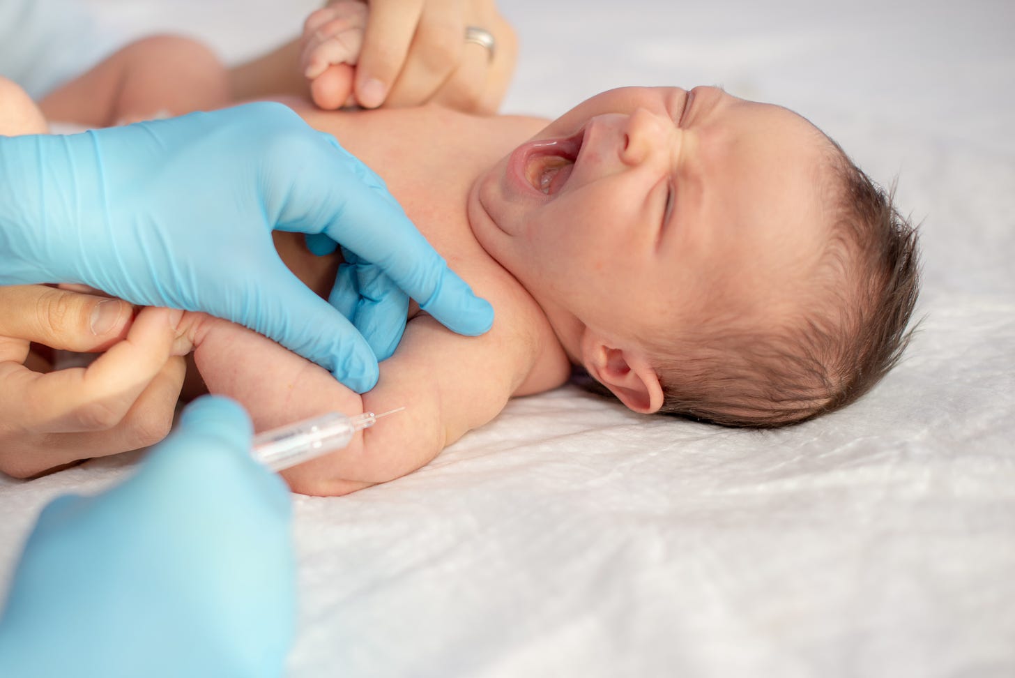 Baby crying while receiving a vaccination