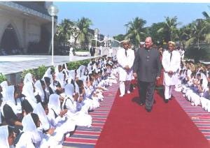 Imam Shah Karim al-Husayni walks among his murids in Pakistan (2000).