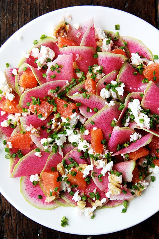 Watermelon radish salad with goat cheese, oranges, and walnuts.