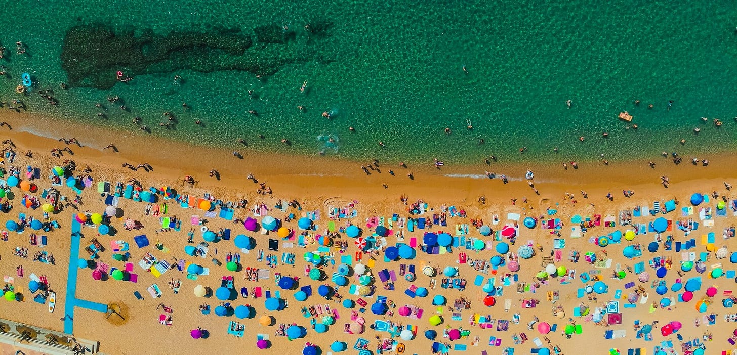 aerial view of crowd on Catalonian beach aerial view of crowd on Catalonian beach