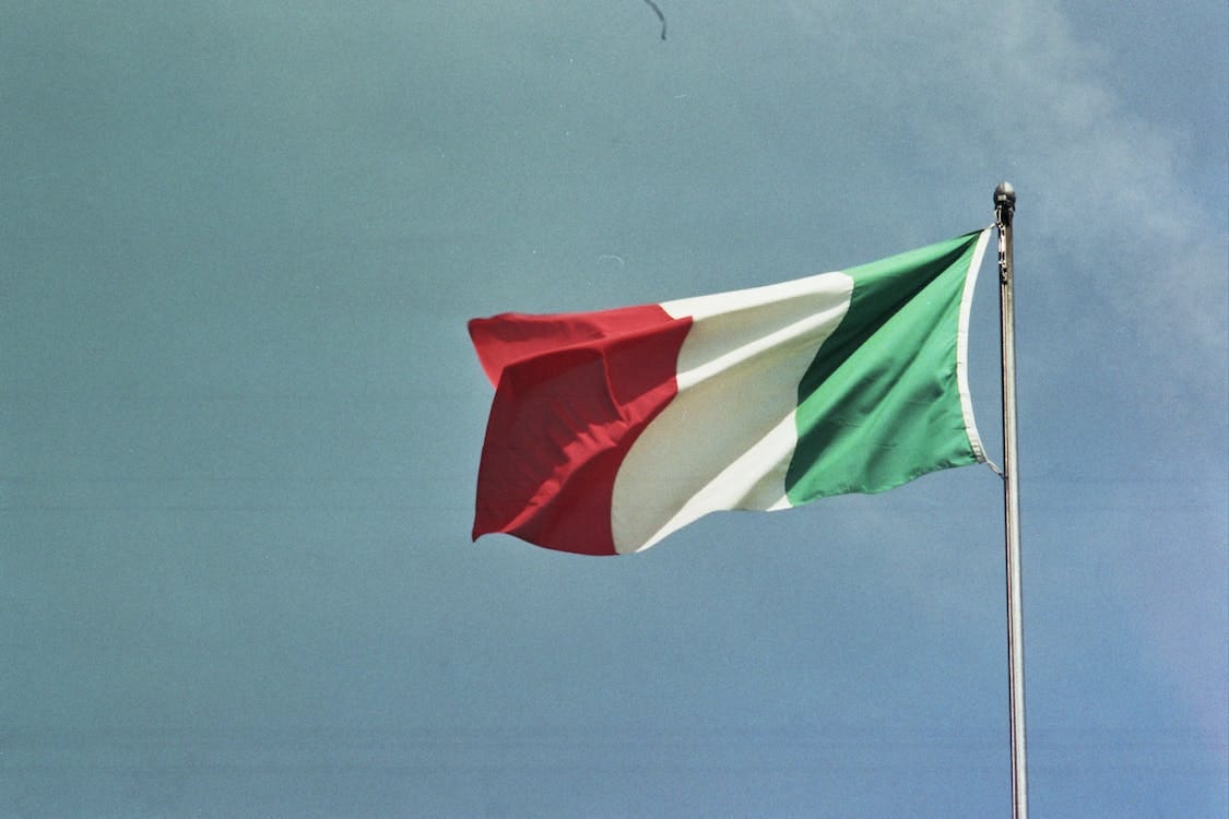 Free Italy Flag on Pole Stock Photo