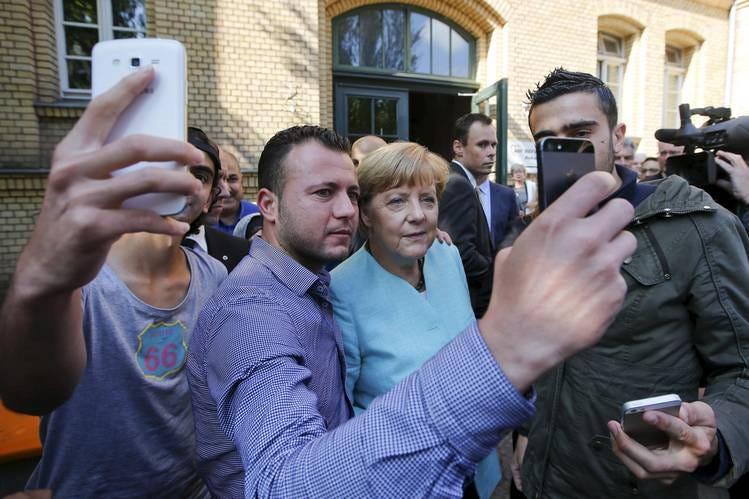 Behind Angela Merkel's Open Door for Migrants - WSJ