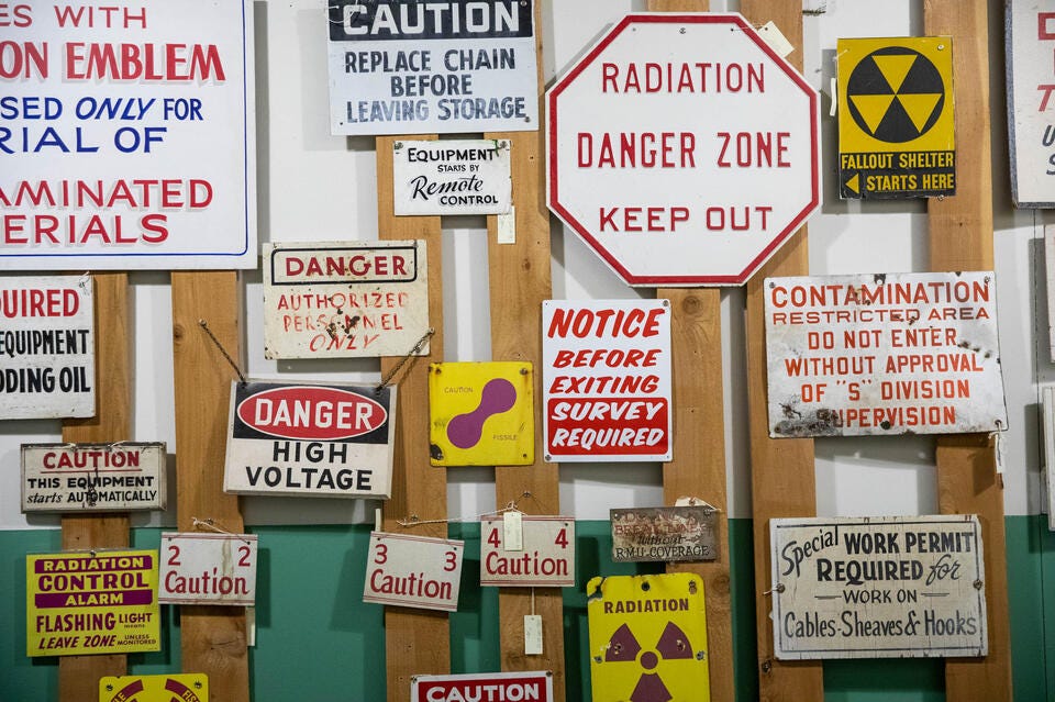 Historical hazardous signs shown at the B Reactor at the Hanford site on Wednesday, Oct. 12, 2022. The B Reactor was the first full-scale plutonium production reactor in the world. Historical hazardous signs shown at the B Reactor at the Hanford site on Wednesday, Oct. 12, 2022. The B Reactor was the first full-scale plutonium production reactor in the world.