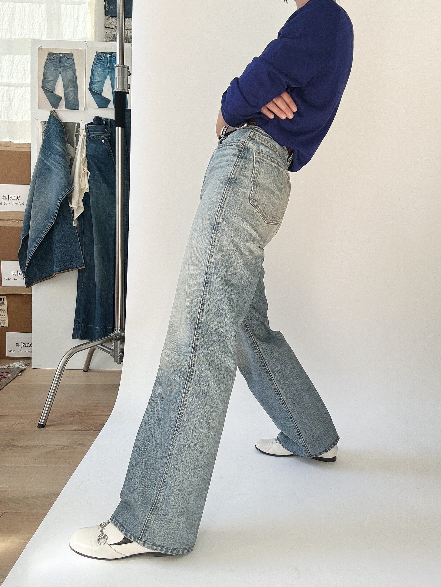 Ruadh denim with Gucci white loafers and a purple top