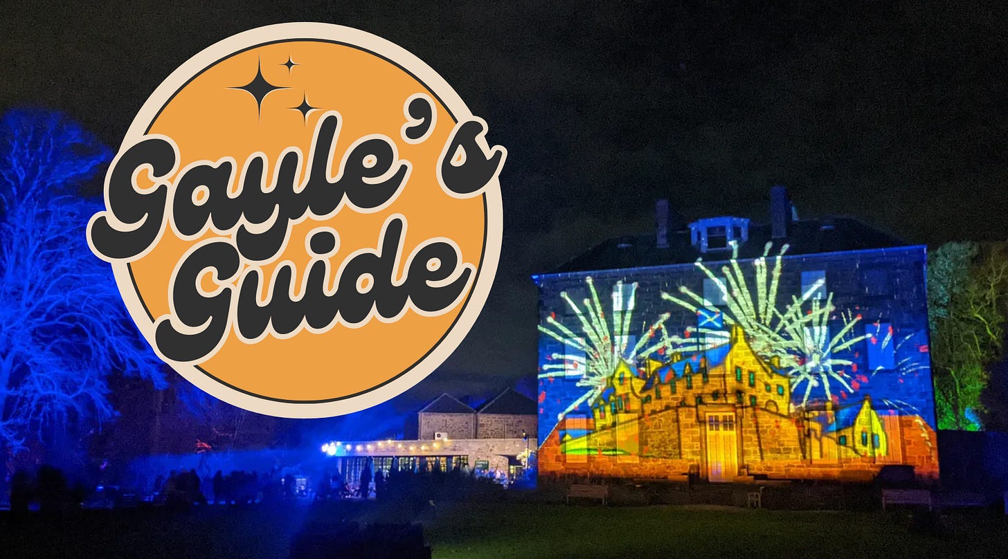 light projections on a building in the botanic gardens depicting edinburgh castle with fireworks. Gayle's guide logo