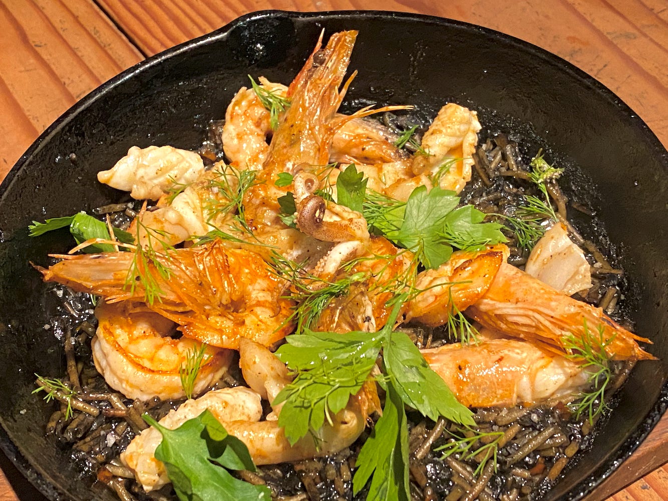 A plate of shrimp over the Black Seafood Fideua at Pan Sal Aire in Barranco, Lima