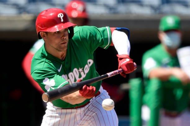 Scott Kingery of the Philadelphia Phillies lays down a sacrifice bunt during the third inning against the Detroit Tigers during a spring training...