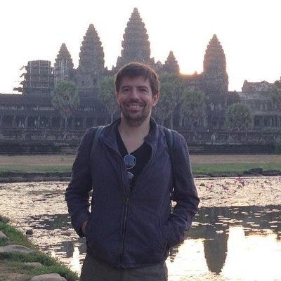 The Twitter profile of Anthony LaMesa, a white man posting in front of some temples in Thailand.