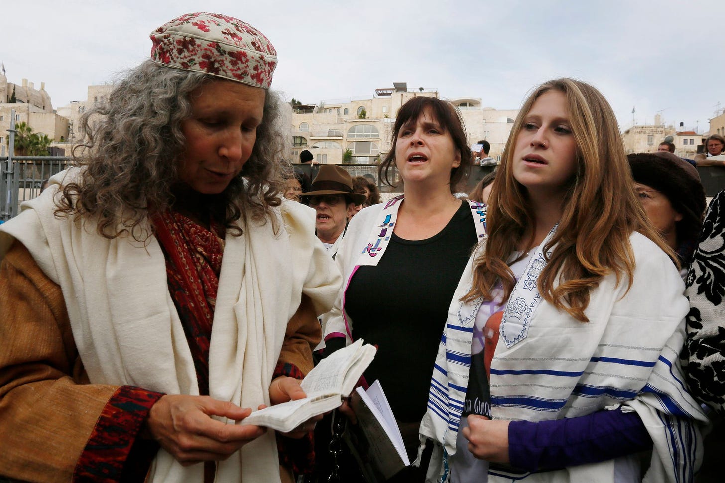 Rabbi Susan Silverman (C) and her daughter Hallel (R), seen wearing a prayer shawl as they pray together with women of the "Women of the Wall" organization at the Western Wall, Judaism's holiest site, in Jerusalem on April 11, 2013. Photo by Miriam Alster/FLASH90)