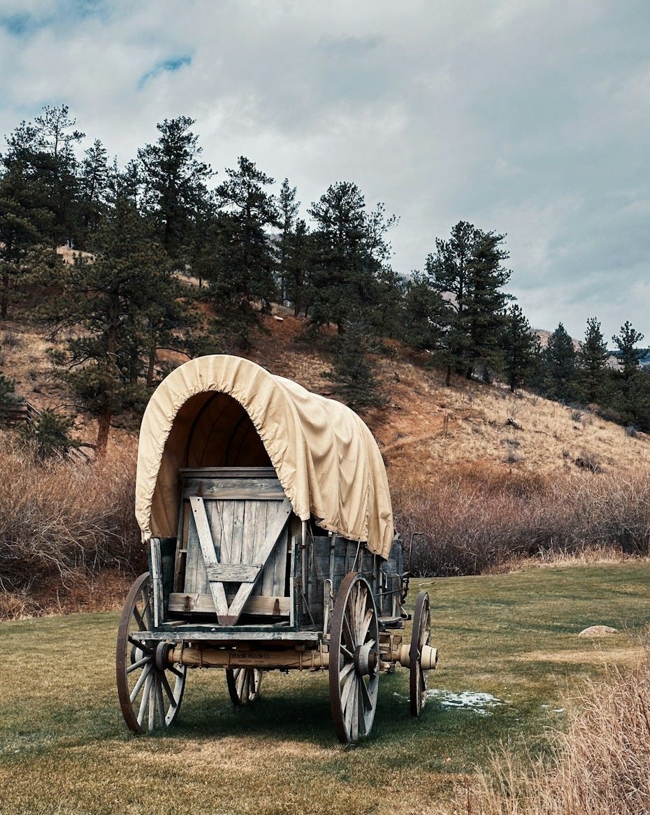 a wagon with a cover on it